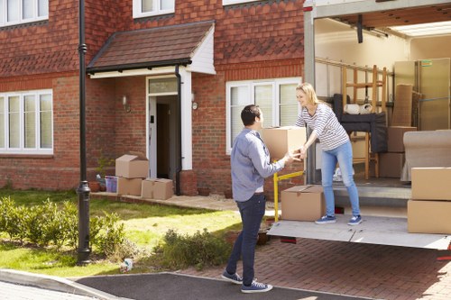 Removal team planning a house move in Harrow with boxes and furniture