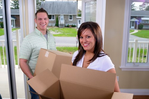 Packed household boxes and furniture ready for transport in Harrow