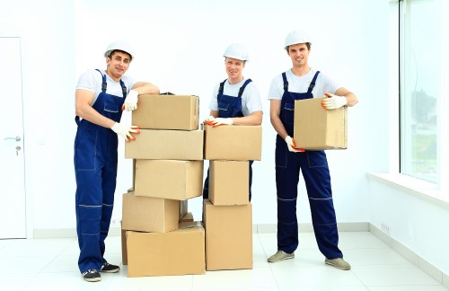 Loading household furniture into a van in Harrow