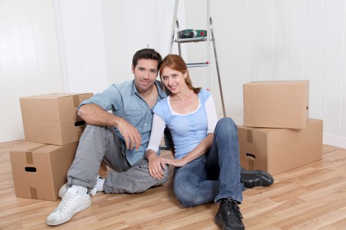 Professional movers loading a van for a home relocation in Harrow