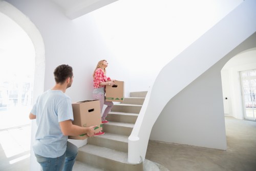 Packed moving boxes and furniture ready for local removals in Harrow