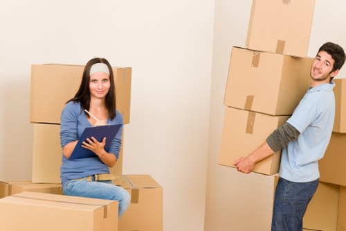 Loading furniture into a moving truck for a Harrow relocation